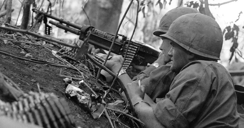 Soldiers Laying Down Covering Fire. Vietnam War, 1966.