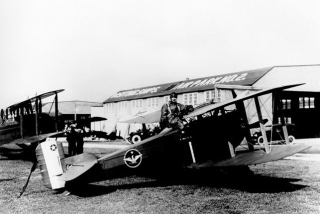 Mitchell posing with a Thomas Morse MB-3.