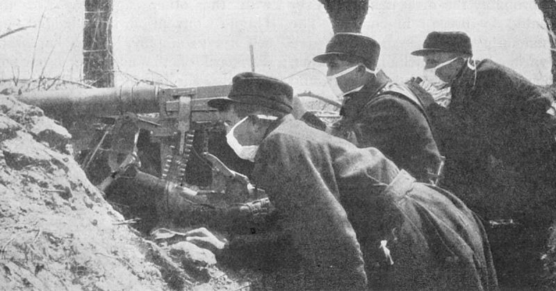 Belgian machine gunners with very early gas masks during World War I.
