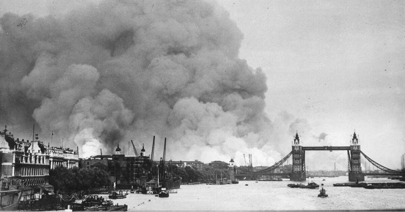 Smoke rises behind the iconic London Bridge after an air raid.
