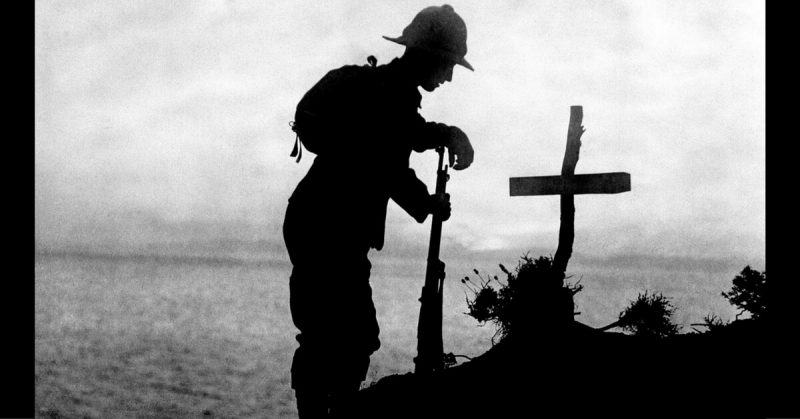 A British soldier paying his respects at the grave of a fellow soldier near Cape Helles where the Gallipoli landings took place, 19 November 1915.