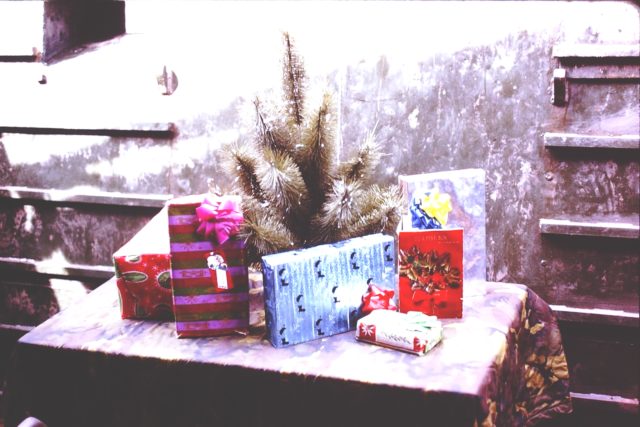 Thompson and his fellow sailors spent the Christmas of 1968 aboard their Tango boat in Vietnam. Pictured is the tree and gifts Thompson used in celebration of the holiday. Courtesy of Roger Thompson.