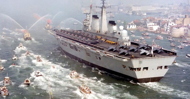 HMS Invincible returns following the Falklands Conflict in 1982. <a href=https://commons.wikimedia.org/w/index.php?curid=26798381
>Photo Credit</a>