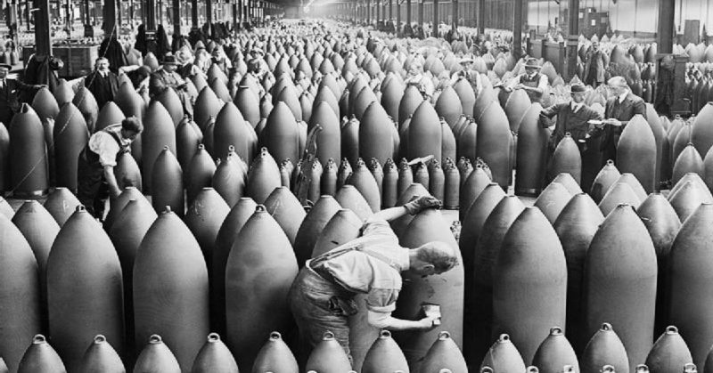 Munition workers painting shells at a shell factory, during the WWI.