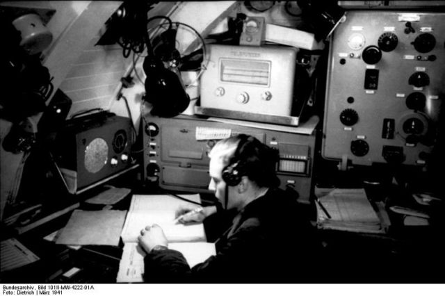 Enigma radioman aboard U-124 March 1941. By Bundesarchiv – CC BY-SA 3.0 de