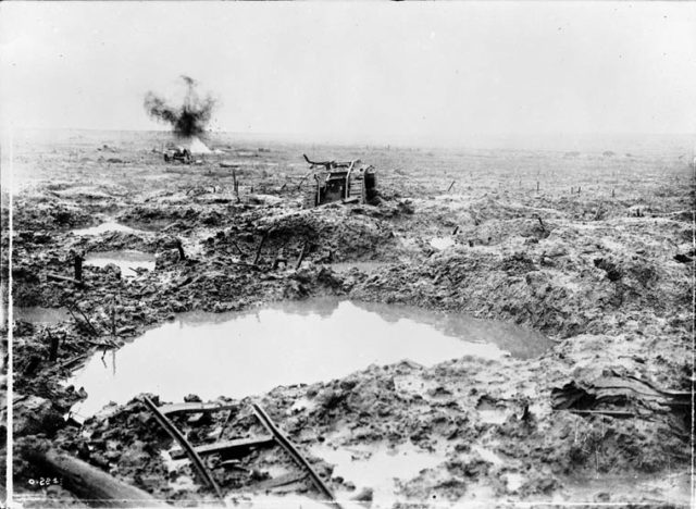 Derelict Tank in badly shelled mud area.