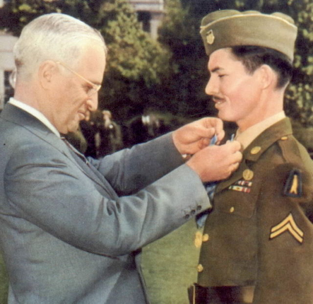 Corporal Doss receiving the Medal of Honor from President Harry Truman on October 12, 1945.