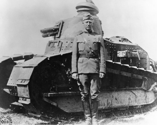 Patton as a young Lieutenant Colonel in France in 1918, with an early French Tank.