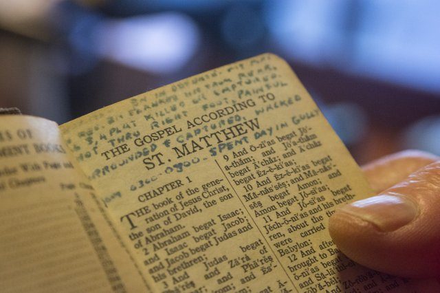 A close-up of a page in a Bible carried by (then) U.S. Army 1st Lt. William H. Funchess while he was a prisoner of war during the Korean War for 34 months. He wrote on the page after his first night of captivity. It reads: "Battalion in defense. My platoon in rear. Battalion flanked and hit from rear. All 3rd and 4th platoons killed or captured. Shot through right foot. Painful. Surrounded and captured. Walked from 3am to 8am. Spent day in gulley. Walked all night." Funchess was held in the same prison compound and became very close to Army Chaplain Father Emil J. Kapaun, who received the Medal of Honor posthumously in 2013 for his acts of courage and compassion as a prisoner of war. Funchess and Kapaun read from this Bible together on many occasions. Credit: U.S. Army photo by Staff Sgt. Ken Scar.