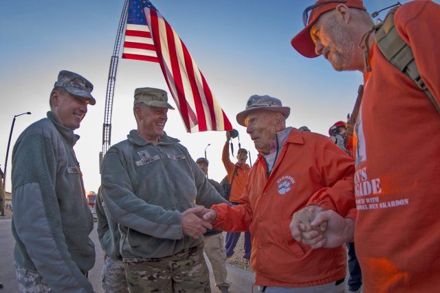 U.S. Army Brig. Gen. Timothy R. Coffin, commander of White Sands Missile Range, greets retired Col. Ben Skardon, 98, a survivor of the Bataan Death March, before the start of the Bataan Memorial Death March, March 20, 2016. Skardon is the only survivor who walks in the march, going more than eight miles nine years in a row. Credit: U.S. Army photo by Staff Sgt. Ken Scar.