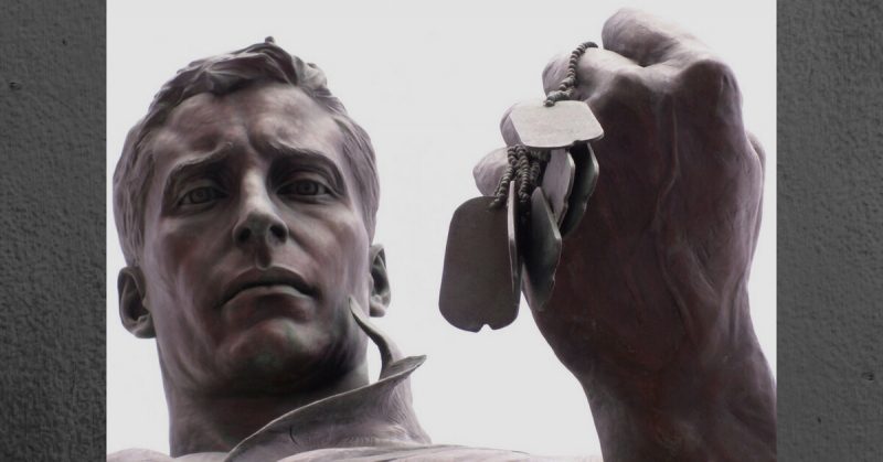 This powerful image is a detail from the New Jersey Korean War Memorial, Atlantic City boardwalk. The soldier gazes reflectively at a fist full of dog tags. Are they from his lost brothers-in-arms? By Jackie - CC BY 2.0