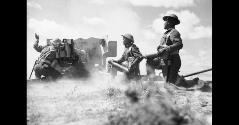 Gurkhas in action with a 6-pounder anti-tank gun in Tunisia, 16 March 1943.