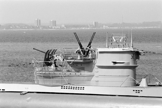 The conning tower and flak emplacements of a Type VII U-boat. Her periscopes are visible either side of the main tower. These allowed her commander to see over the surface of the water, while most of the hull remained hidden below.