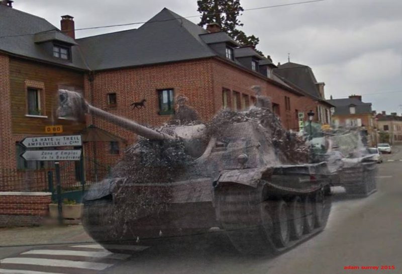 2 camouflage German tank destroyers race through the main road of Bourgtheroulde-Infreville Normandy July 1944 – 2015 / By Adam Surrey / Ghosts of Time