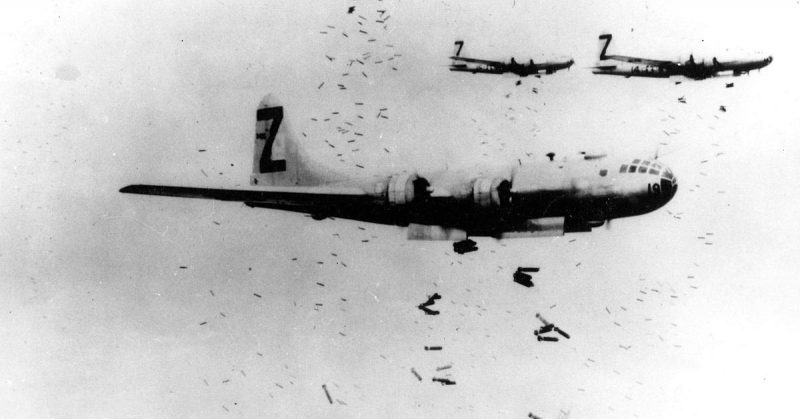 Dropping bombs over Japan during WWII.