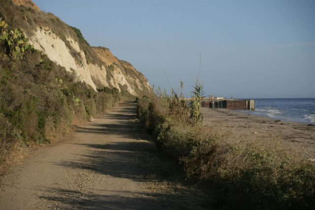 The original macadam service road running along the base of the bluff at the site of I-17’s attack is still used by VENOCO, Inc. (photo by the author)