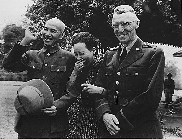 Chiang Kai Shek and his wife with Lieutenant General Stilwell.