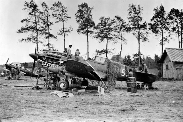 Maintenance on a Curtiss P-40 of the American Volunteer Group (“Flying Tigers”), 1941.