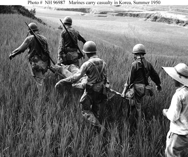 US Marines in Korea carrying one of their wounded in August 1950.