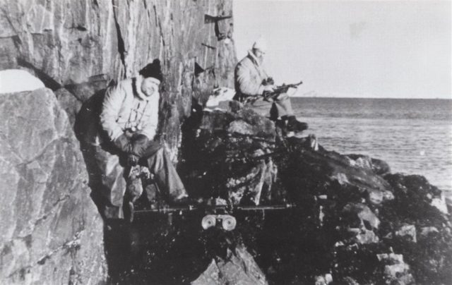 U-boat crewmen from U-537 function as a lookouts during the installation of the weather station on the Hutton Peninsula near Cape Chidley on Newfoundland’s Labrador coast on October 23, 1943. Note that they are armed with a 7.92mm MG-15 machine gun and a 9mm MP-40 sub-machine gun.