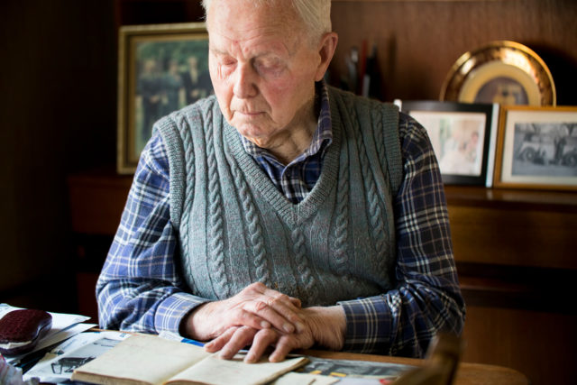 Bernard looking at his book.