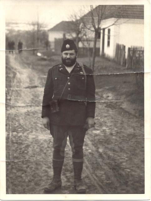 OSS 1st Lieutenant George Musulin in a village in German-occupied Serbia, November 1943. He is wearing a Chetnik cap and an American uniform;
