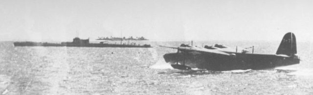 Kawanishi H8K Emily refueling from L-class submarine, type used in Operation K, location unknown