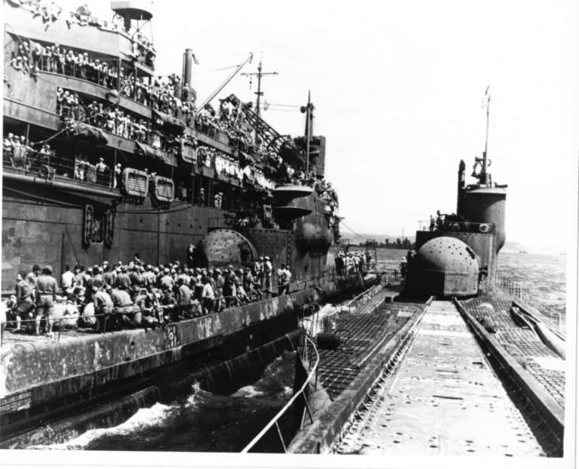 Photo above depicts the surrender of I-400 and I-401 to the US Navy on 28 Aug 1945. Both submarines next to each other, with all the POW sailors sitting on deck under the massive attention of the US ship crews. That surrender was too much for the Commander of the fleet onboard, he committed suicide but the rest of the crew gave up. The subs were entered by US Navy and sailed to Tokyo, as you can see on this fascinating photo right after their surrender.