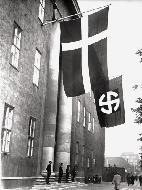 The Nazi flag beside the Danish one at the Schalburg Corps building which served as the Danish SS office in Copenhagen; 