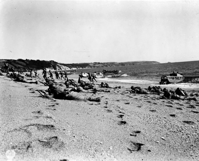 American troops landing on beach in England during rehearsal for invasion of Nazi occupied France.