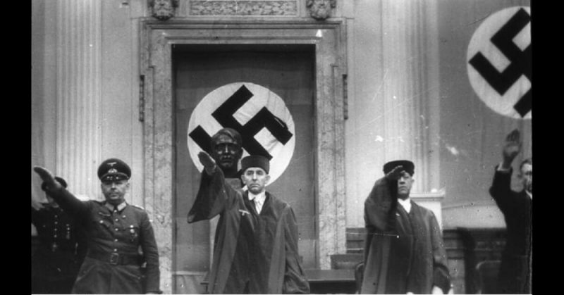 General of the Infantry Hermann Reinecke (left), President Roland Freisler (middle), and Chief Public Prosecutor Ernst Lautz at the People's Court on February 3, 1945. Bundesarchiv - CC-BY SA 3.0