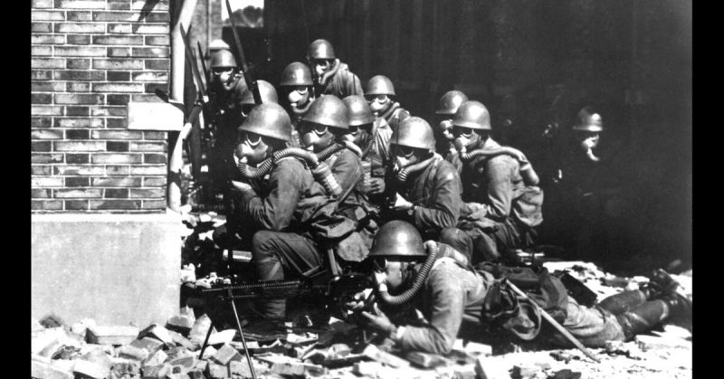 Japanese Troops fitted with Gas Masks during the Battle of Shanghai. 