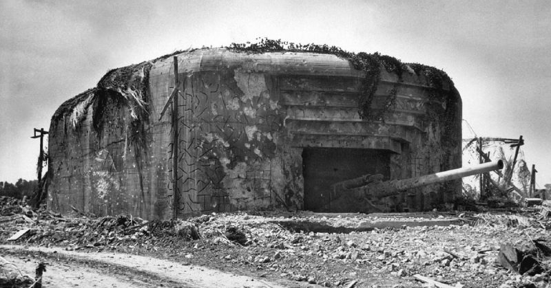 Monster Nazi gun battery silenced in France. This German gun emplacement has walls of concrete 13 feet thick and four guns each with a 10 1/4