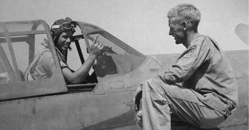 A P-40 pilot of the squadron holds up a finger to tell his crew chief that he has downed a German plane, Paestum airfield, 15 September 1943.