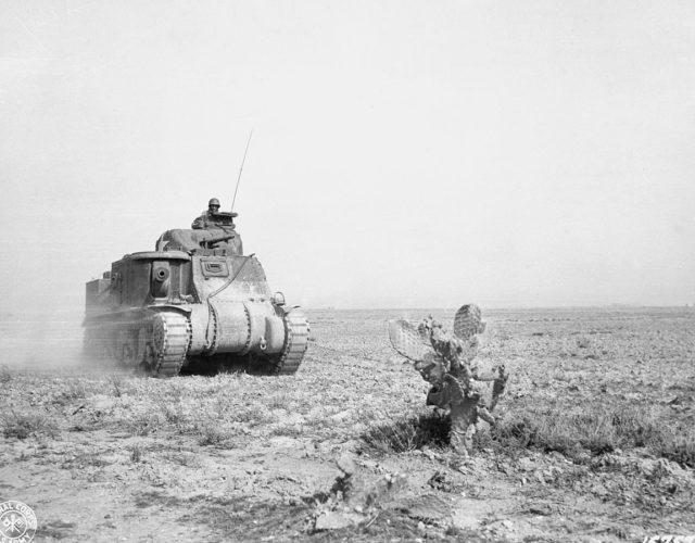 An M3 Lee tank of U.S. 1st Armored Division advancing to support American forces during the battle at Kasserine Pass.