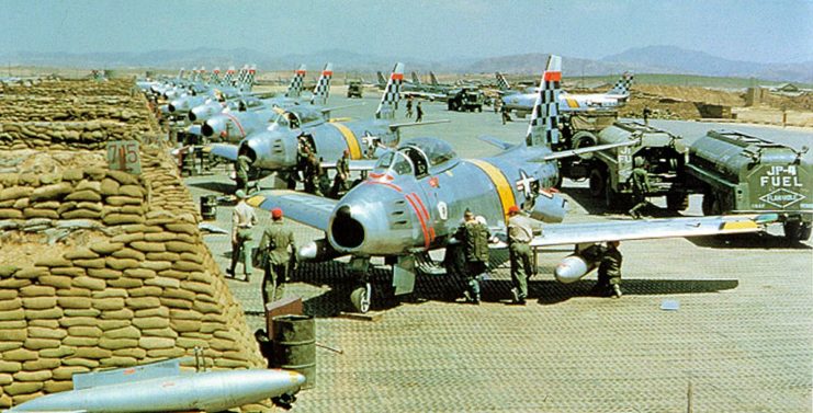 U.S. Air Force North American F-86 Sabre fighters from the 51st Fighter Interceptor Wing Checkertails are readied for combat during the Korean War at Suwon Air Base, South Korea.