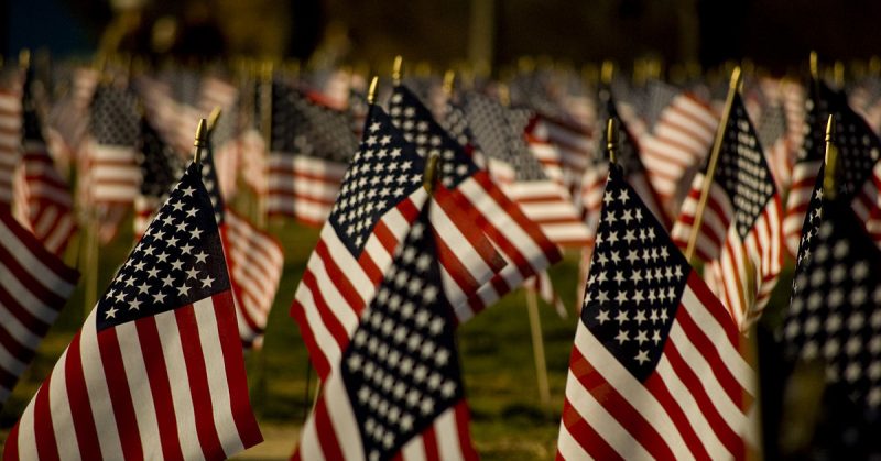 <a href=https://en.wikipedia.org/wiki/File:Americanflags.jpg#/media/File:Americanflags.jpg>Photo Credit</a>