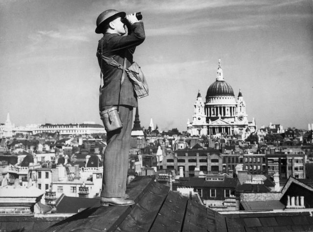An Observer Corps spotter scans the skies of London.