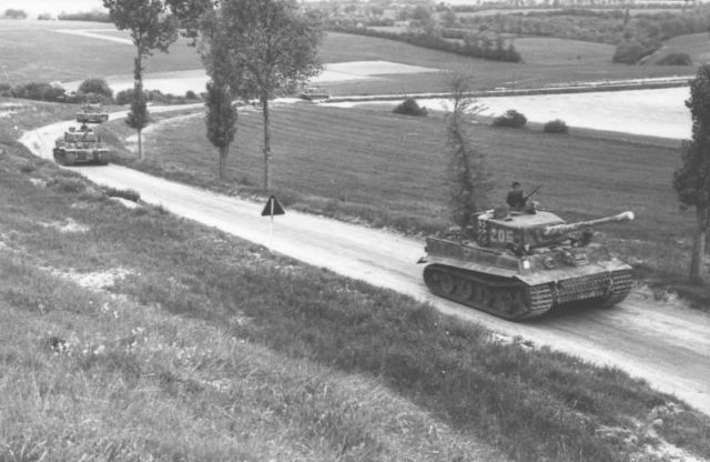 Wittmann’s company, 7 June 1944, en route to Morgny. Wittmann is standing in the turret of Tiger 205. Photo: Bundesarchiv, Bild 101I-299-1804-07 / Scheck / CC-BY-SA 3.0