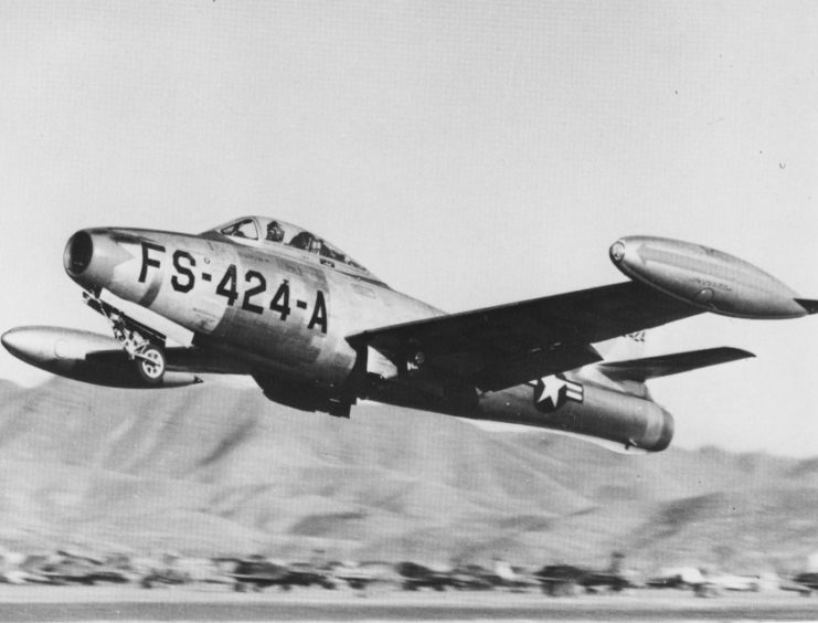 A bomb-laden U.S. Air Force Republic F-84E-15-RE Thunderjet (s/n 49-2424) from the 9th Fighter-Bomber Squadron, 49th Fighter-Bomber Wing/Group, taking off for a mission in Korea. This aircraft was shot down by flak on August 29, 1952.