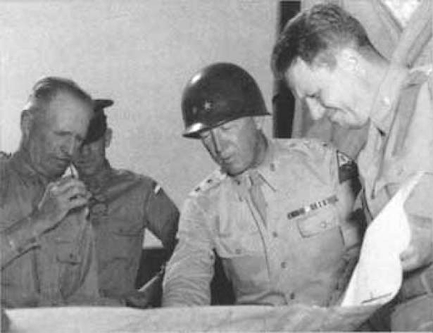 McNair and George S. Patton, commander of I Armored Corps review map during training exercise at Desert Training Center, 1942.