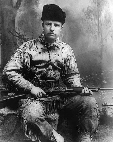 Teddy Roosevelt with his engraved Winchester Model 1876.