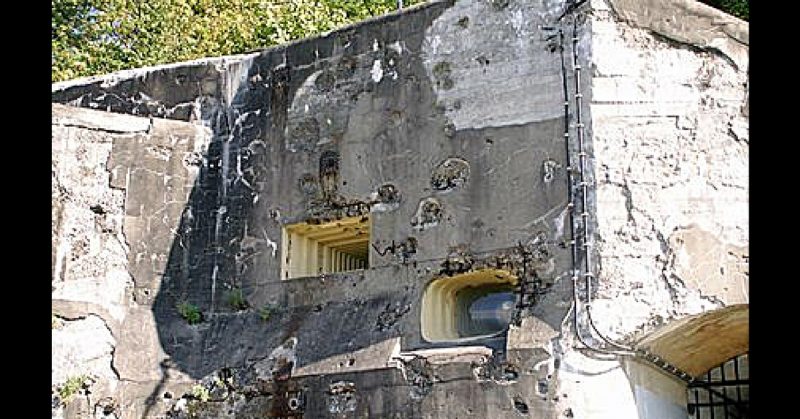 Bullet damage on the fortifications at Eben-Emael. Scargill - CC-BY SA 3.0