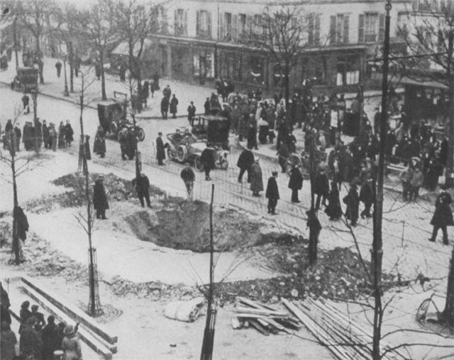 A crater on a Paris street caused by a bomb dropped from a German Zeppelin in 1916.