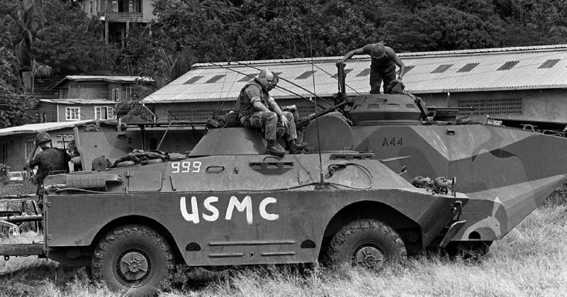 U.S. Marines sit atop a captured Grenadian BRDM-2 during the Invasion of Grenada.