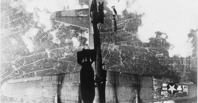 A US B-17 Flying Fortress is hit by bombs dropped by the bomber flying above it, 19 May 1944.