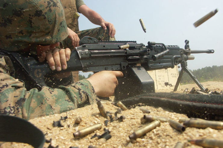 A U.S. Marine fires the PIP-upgraded M249 SAW, an adopted version of the Minimi.