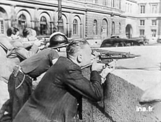 French resistance fighters attacking the police headquarters on August 19, 1944.