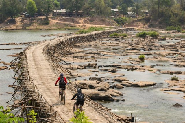 Rebecca Rusch and Huyen Nguyen ride the Ho Chi Minh Trail for the feature film project ‘Blood Road’ in Vietnam, Laos, and Cambodia in March, 2015. // Josh Letchworth