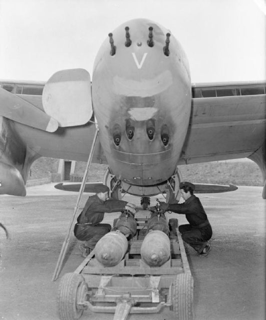 Armourers prepare to load four 500-lb MC bombs into the bomb-bay of De Havilland Mosquito FB Mark VI, MM403 ‘SB-V’, of No. 464 Squadron RAAF at RAF Hunsdon, Hertfordshire.